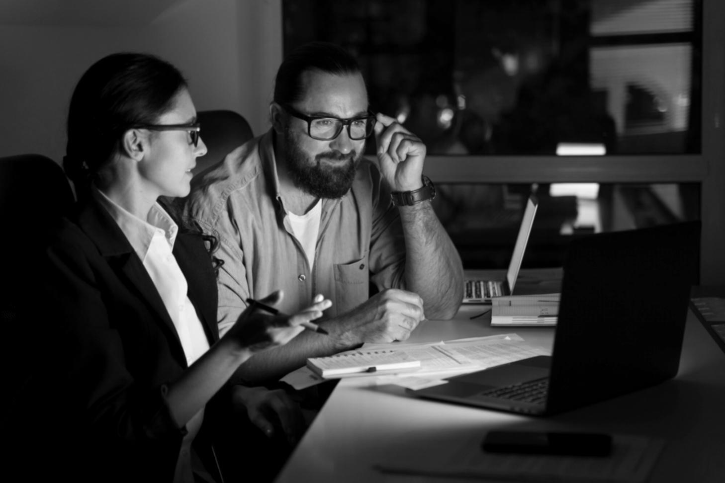 Professional team reviewing financial spreadsheets during training session