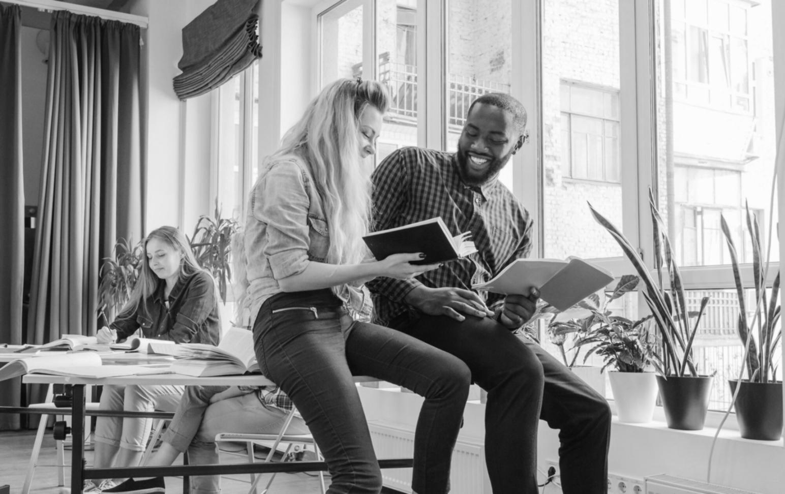Trainer demonstrating advanced spreadsheet automation techniques to corporate team